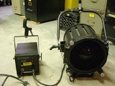 ALTMAN UV 703  UV-703 Description: The Altman UV-703 is a compact, high output fresnel blacklight. It is designed to provide high illumination of flourescent materials. Used UV-703. The fixture does not require any fans for cooling, resulting in extremely quiet operation. The fixture is equipped with barndoor rollers and an integral wire . Used UV-703. mesh safety screen in front of tst single on/off switch with UV-C wavelengths almost all visible light. ard edison connector installed. A special fresnel lens filters out harmful UV-B ballast is simple to operate.
